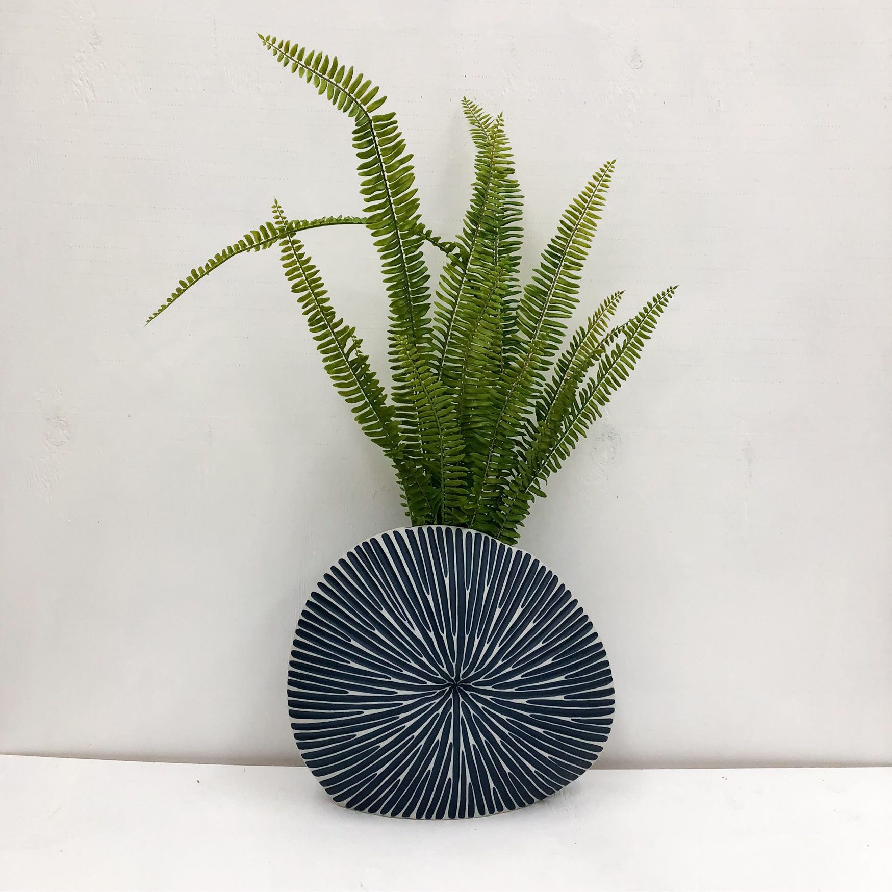 Diva Round Handmade Vase - Blue - front view with plant